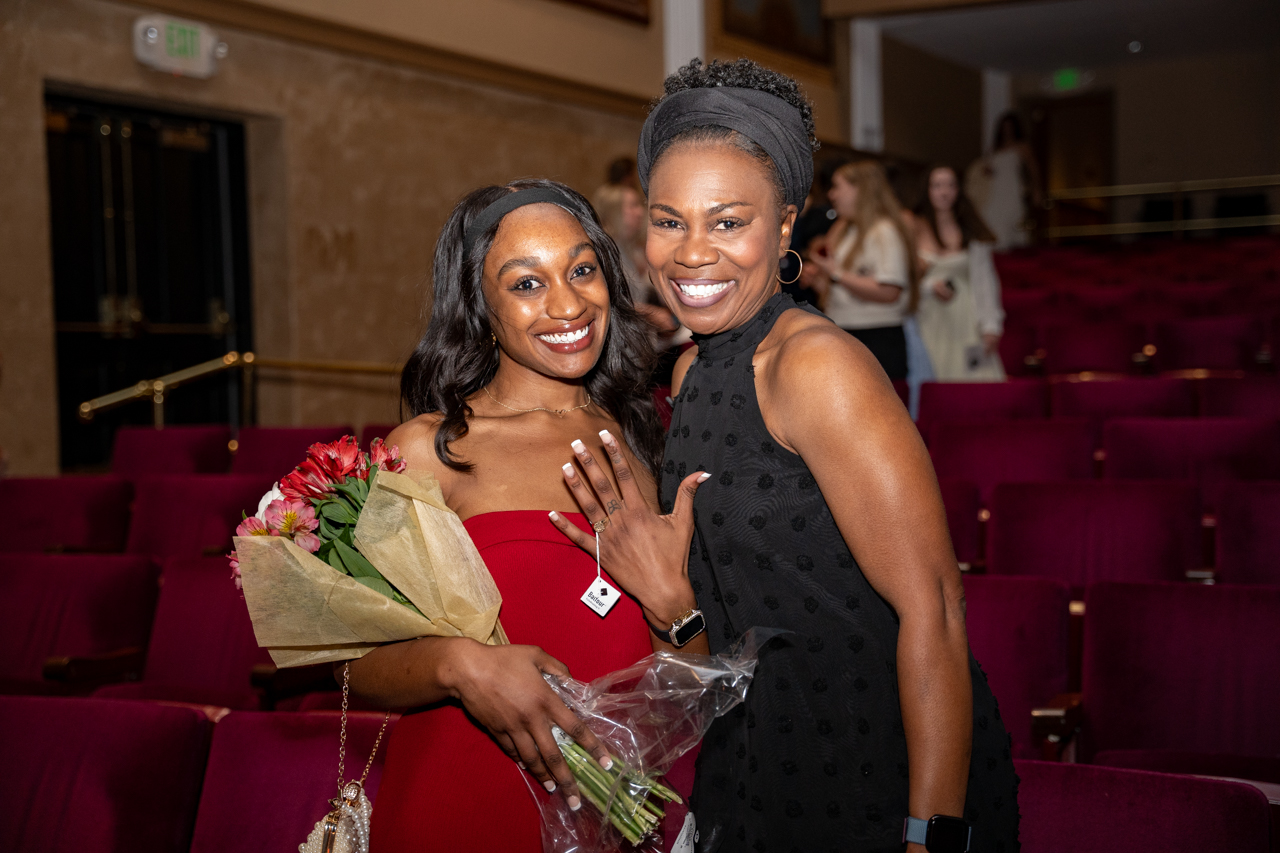 Mom and daughter pose together at ring ceremony 