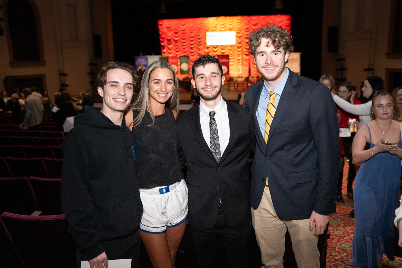 students pose together after the ring ceremony at the Sottile Theatre 