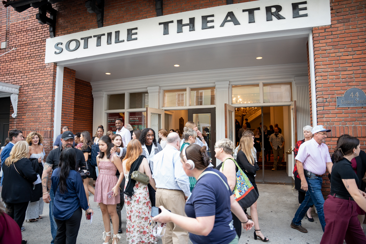 families gather outside the Sottile Theatre 