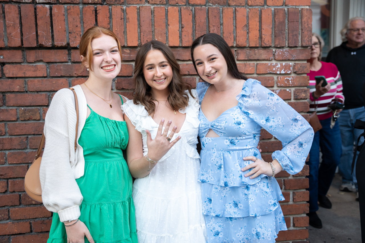 student and friends pose together after ring ceremony 