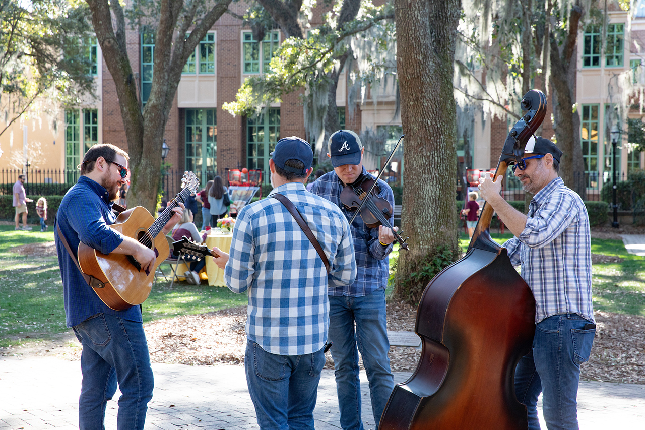 A local band performs for guests of the Cougar Tailgate Party in the Cistern.