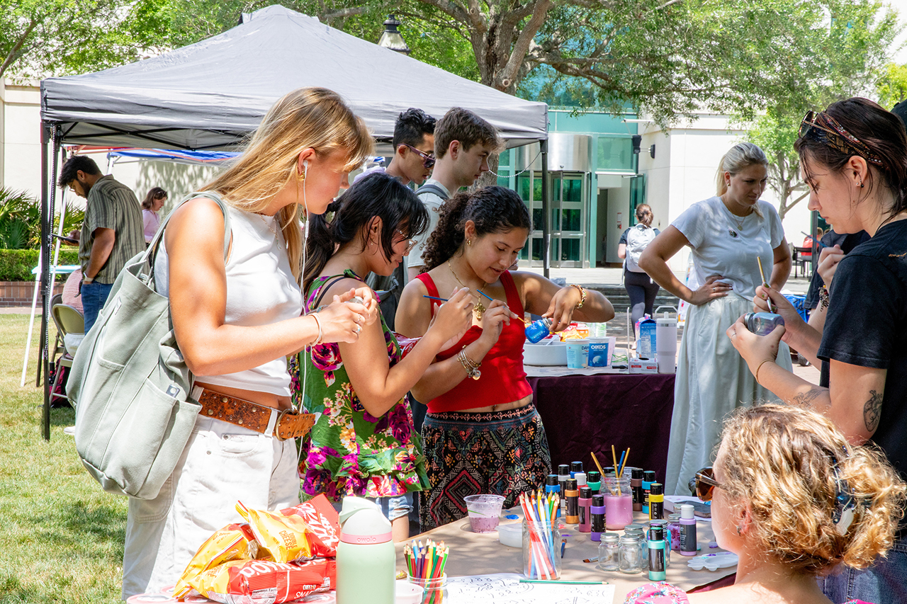 Students attend the Stress Relief Fair in Rivers Green where there are free crafts, food, and therapy dogs.