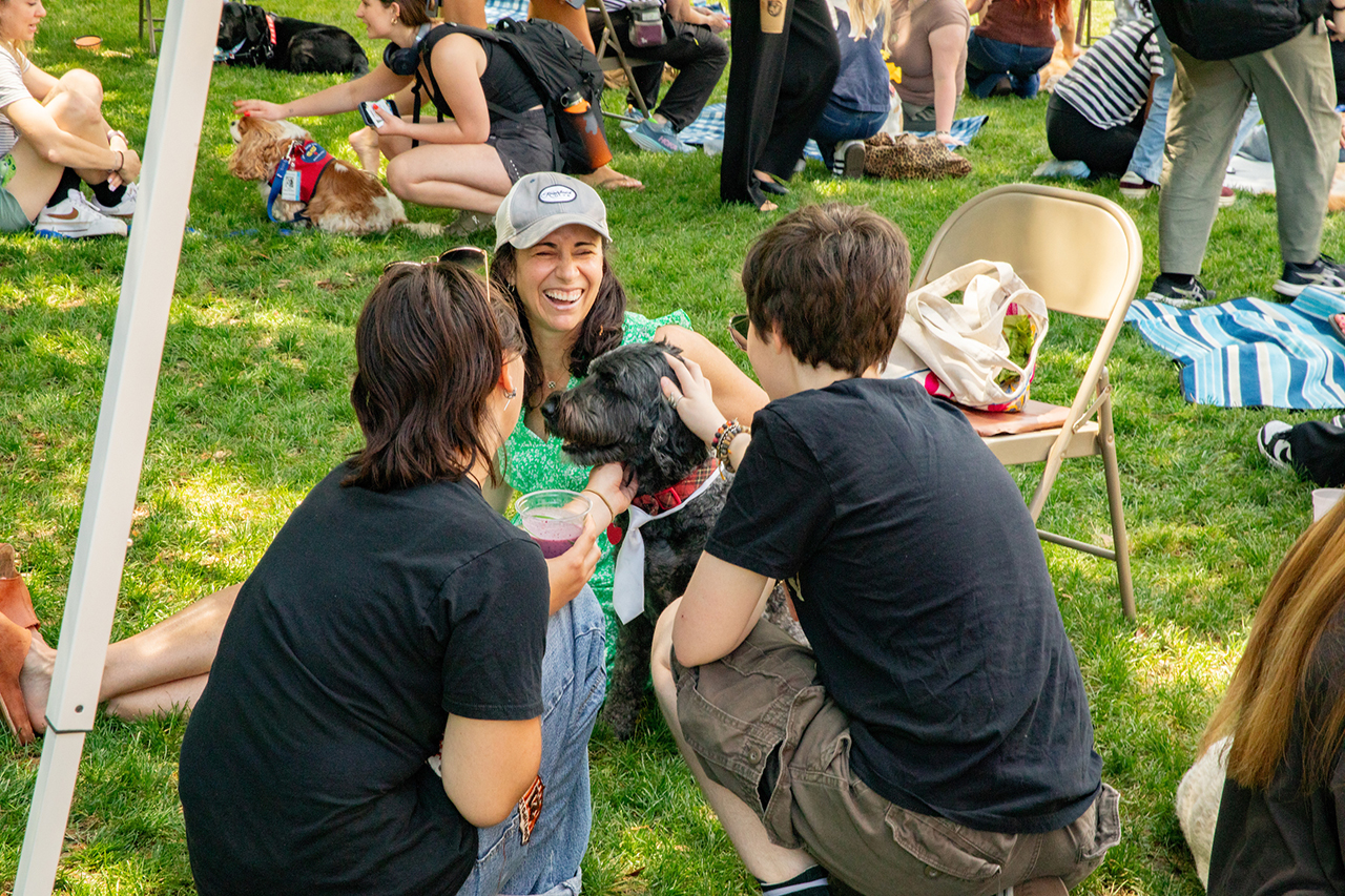 Students attend the Stress Relief Fair in Rivers Green where there are free crafts, food, and therapy dogs.