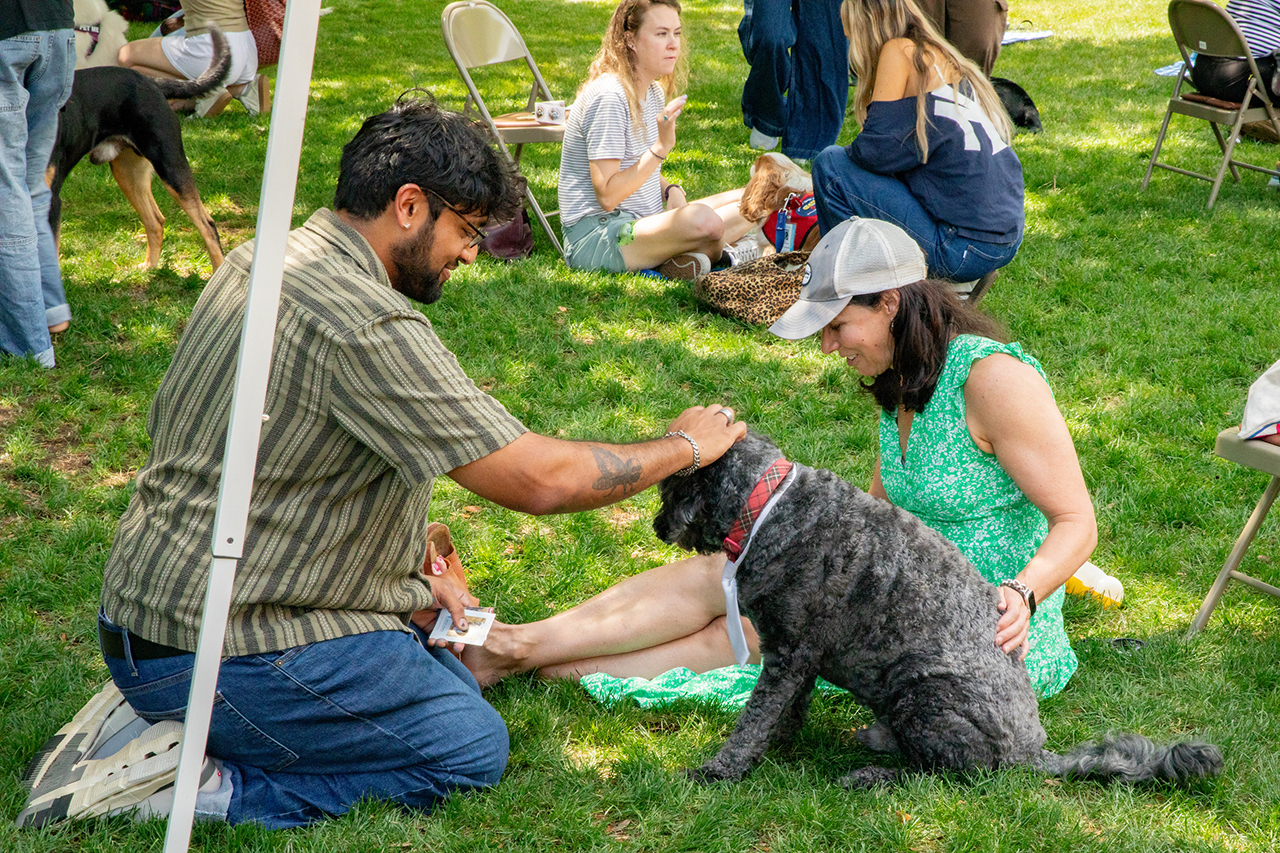 Students attend the Stress Relief Fair in Rivers Green where there are free crafts, food, and therapy dogs.