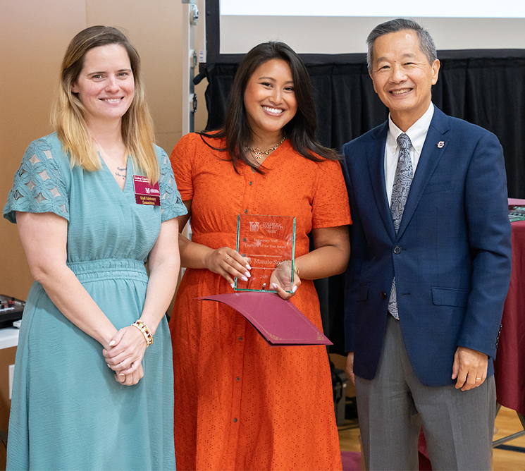 May Manalo Smith, who won the Temporary Staff Employee of the Year, standing with President Andrew T. Hsu and SAC Chair Lindsey Copeland.