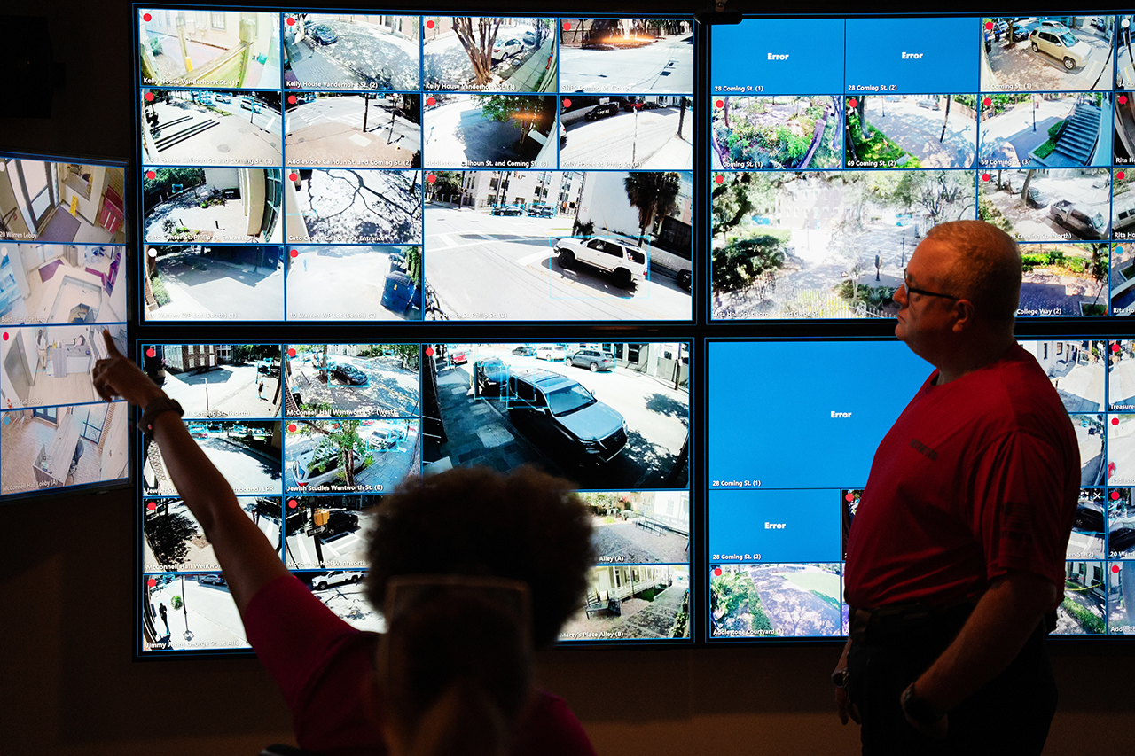 in front of monitors at police academy