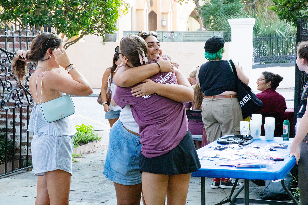 CofC students, alumni, and faculty mingle in the President's house courtyard at the Hillel Welcome Back barbeque.