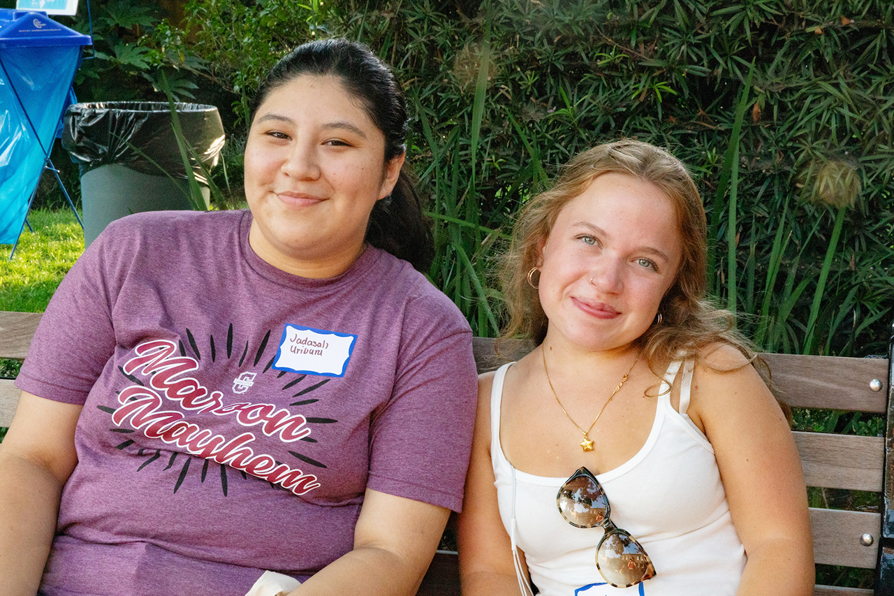 CofC students, alumni, and faculty mingle in the President's house courtyard at the Hillel Welcome Back barbeque.