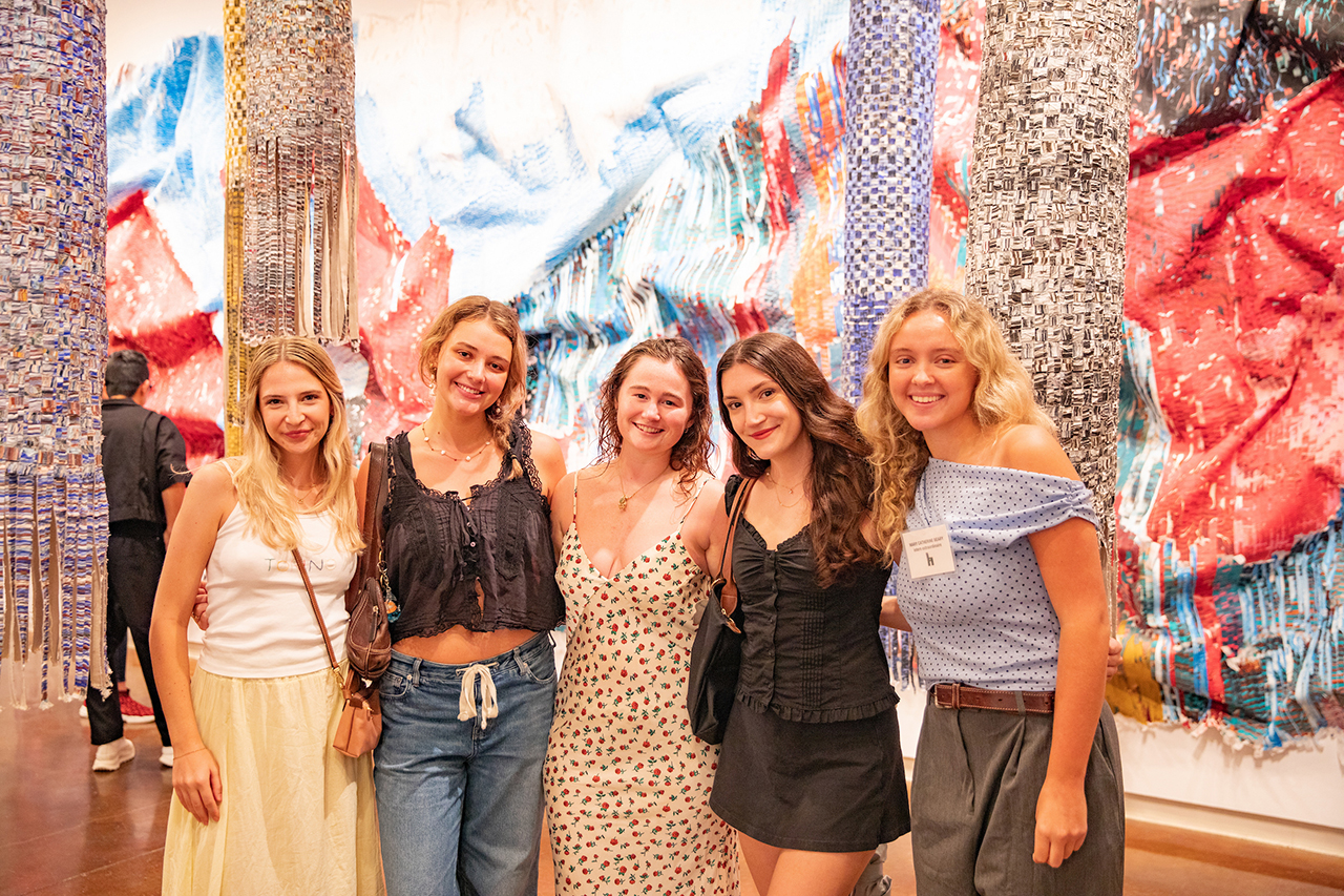 Students, faculty, and members of the community mingle, admire, and interact with Kenny Nguyen's exhibit at Halsey's Opening Reception.
