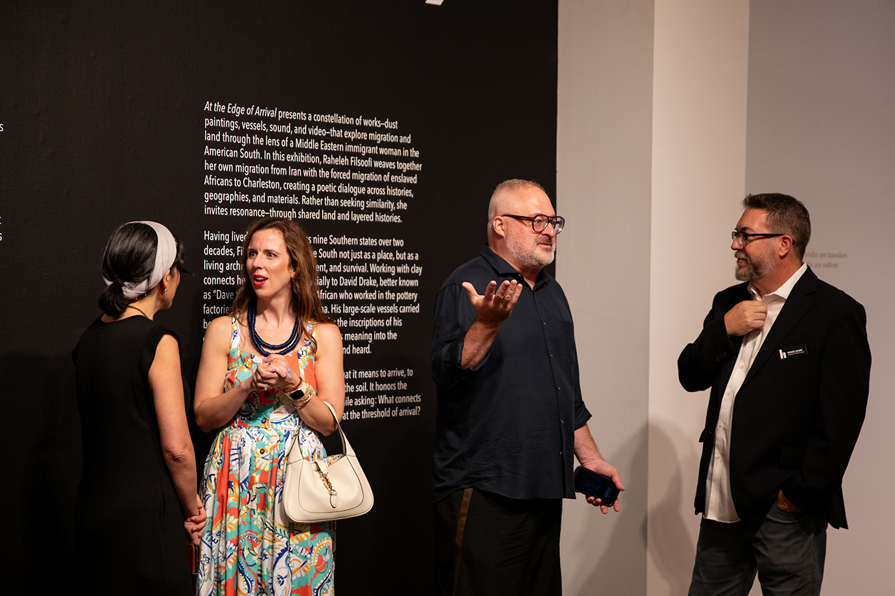 Students, faculty, and members of the community mingle, admire, and interact with Kenny Nguyen's exhibit at Halsey's Opening Reception.