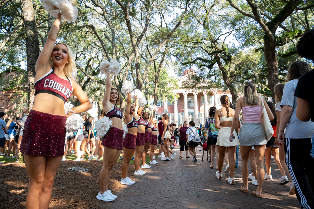 Cheerleaders showing the way for Freshmen