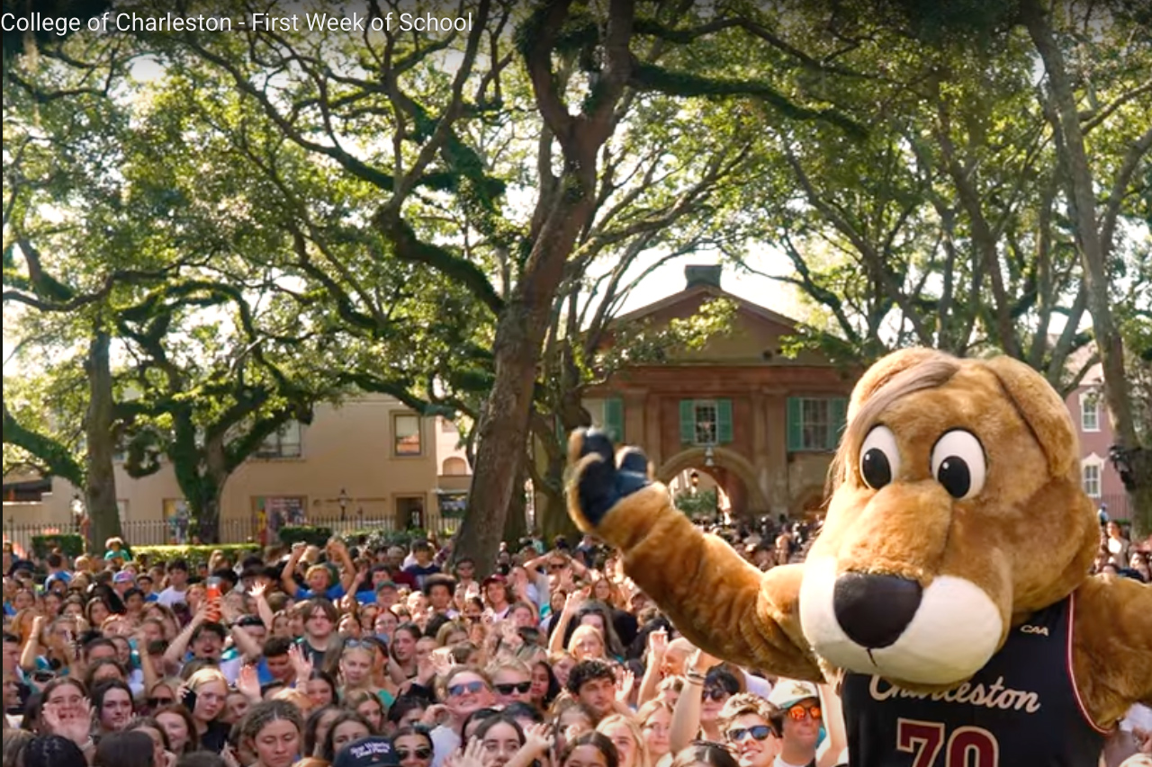 Clyde the Cougar with students