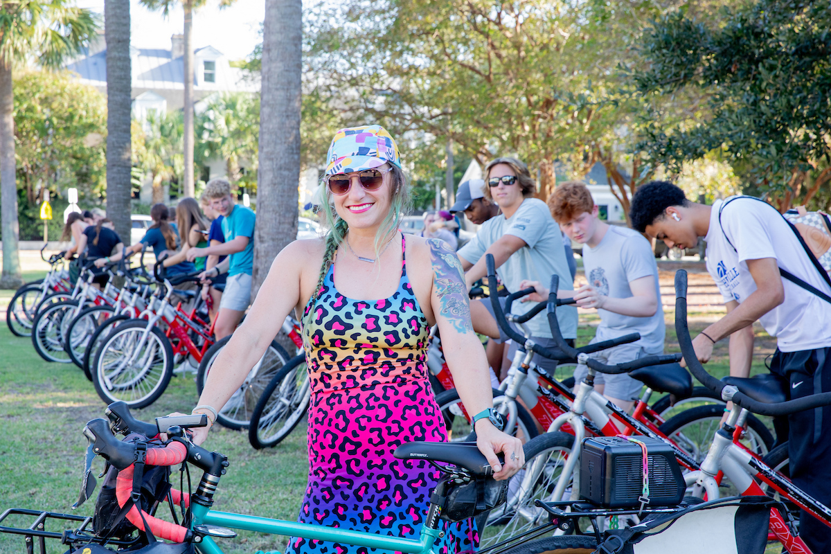 Adjunct professor Sylvie Baele stands with her bike before a class ride for her FYE cycling course.