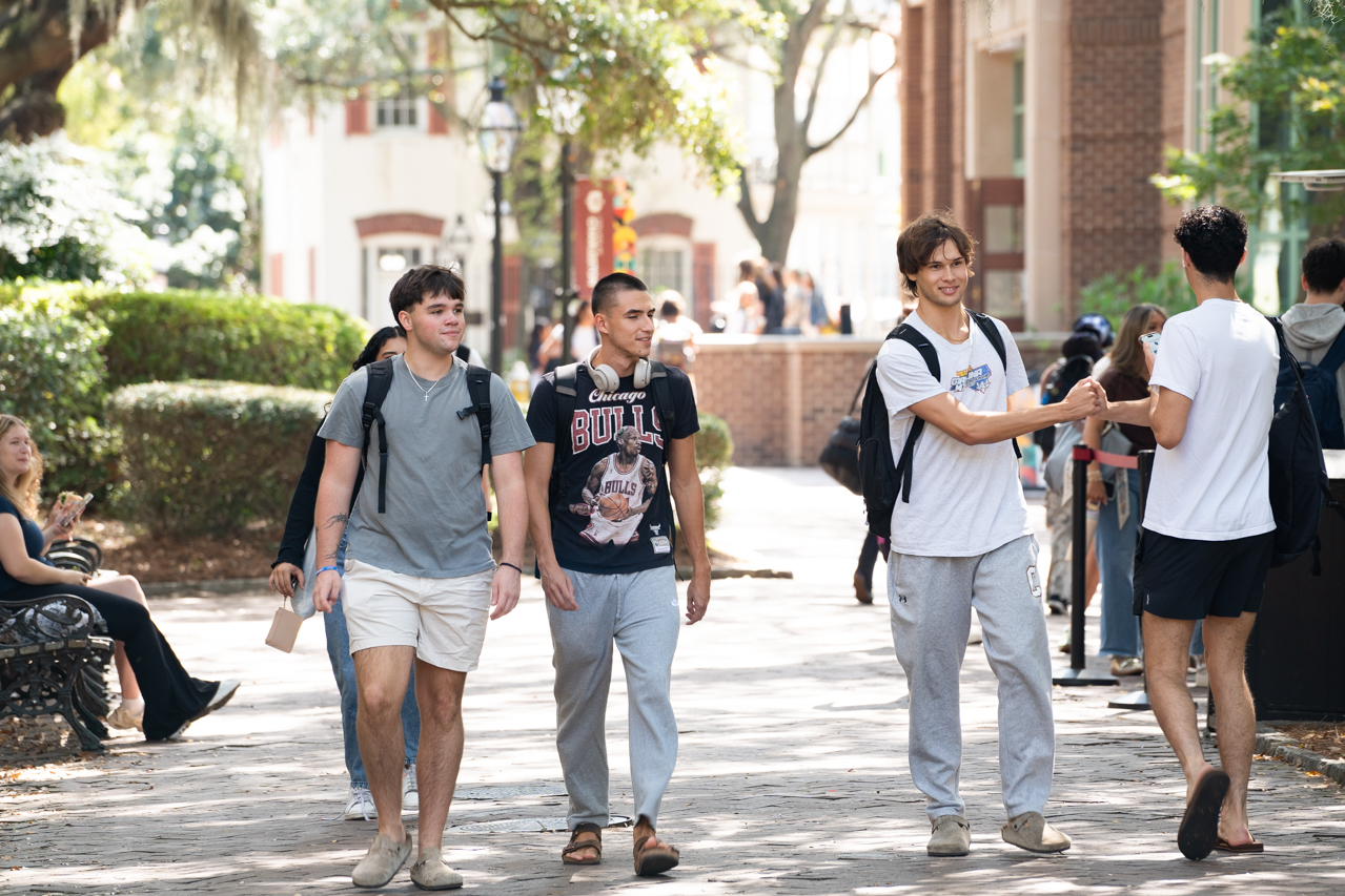 guys greeting each other on campus