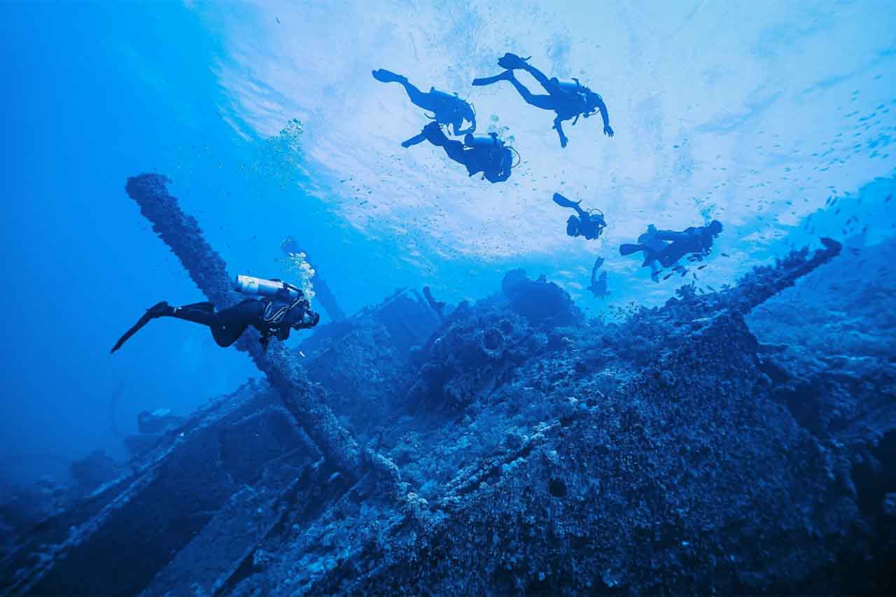 scuba divers under water