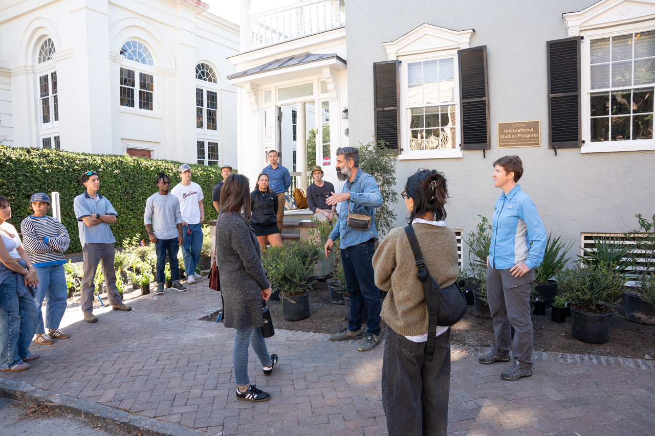 Students and Professors come together to plant native plants in an urban garden on Glebe Street