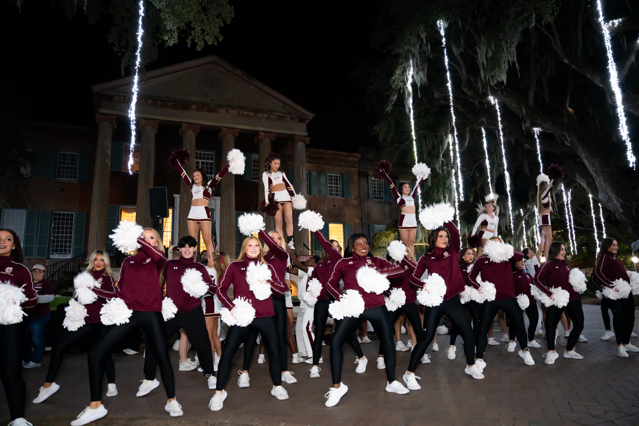 Cheerleaders perform at Homecoming Carnival