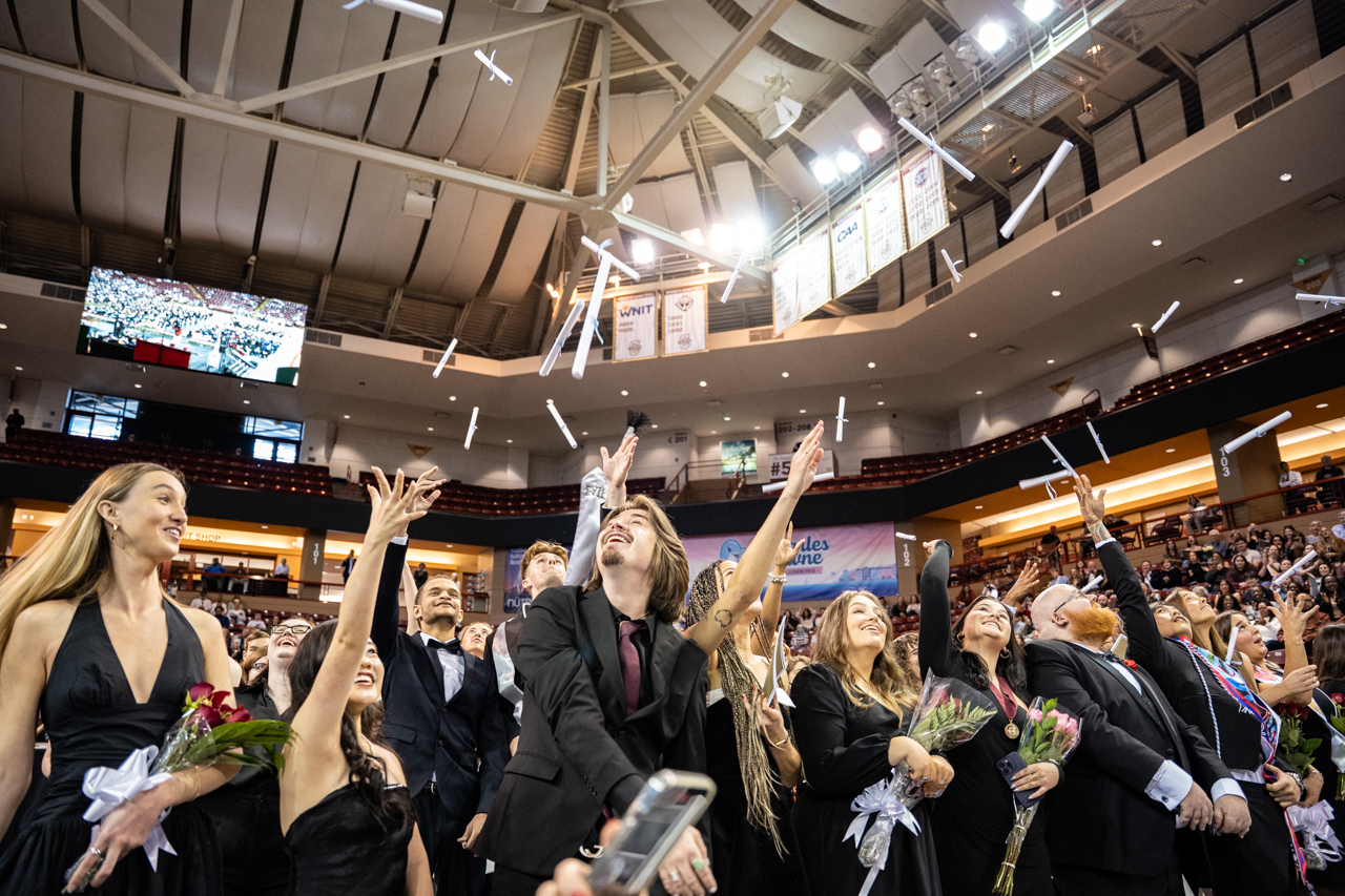 class of 2025 throws their diplomas in the air in TD Arena