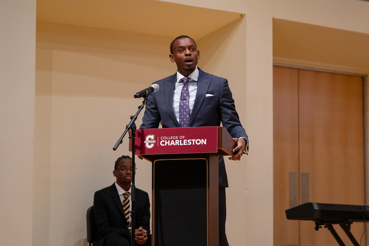 Student at podium gives remarks 