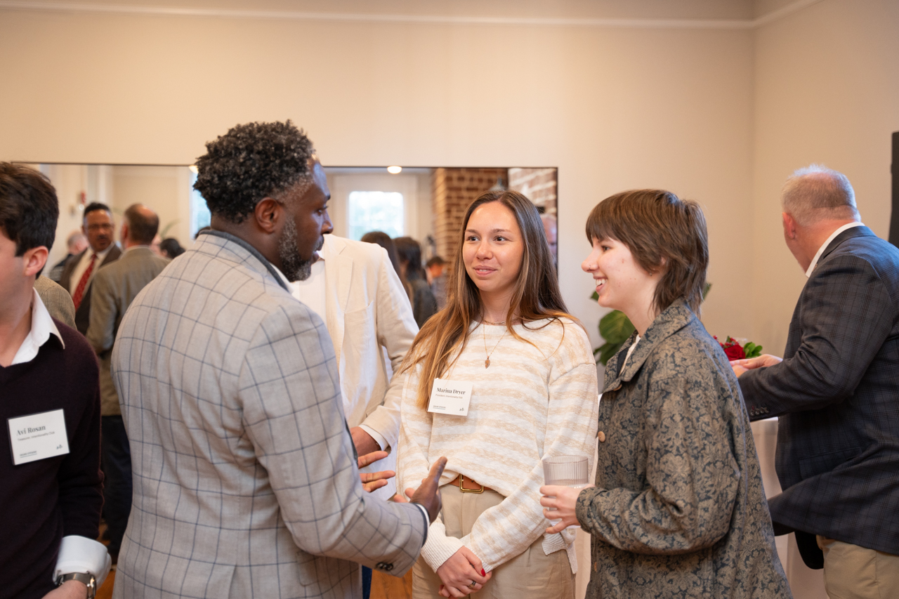 Students talk with Board Members at event