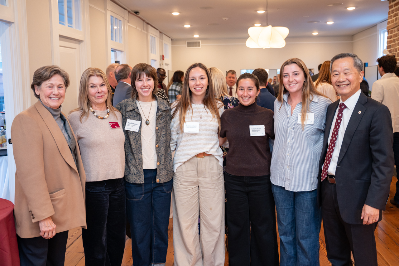students pose with president Hsu and Board of Trustee Members 