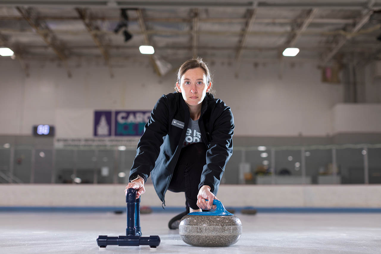 woman curling on ice