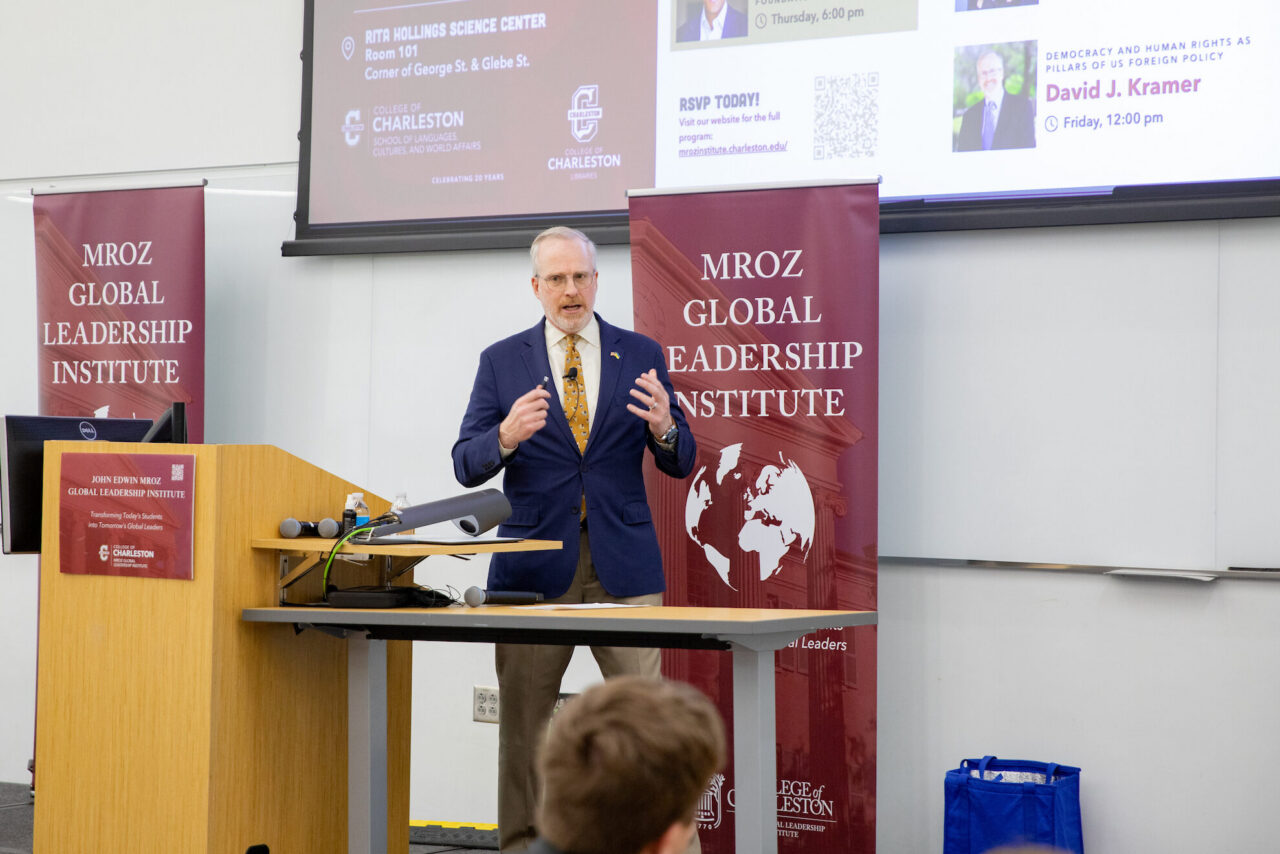 David Kramer speaks at podium.