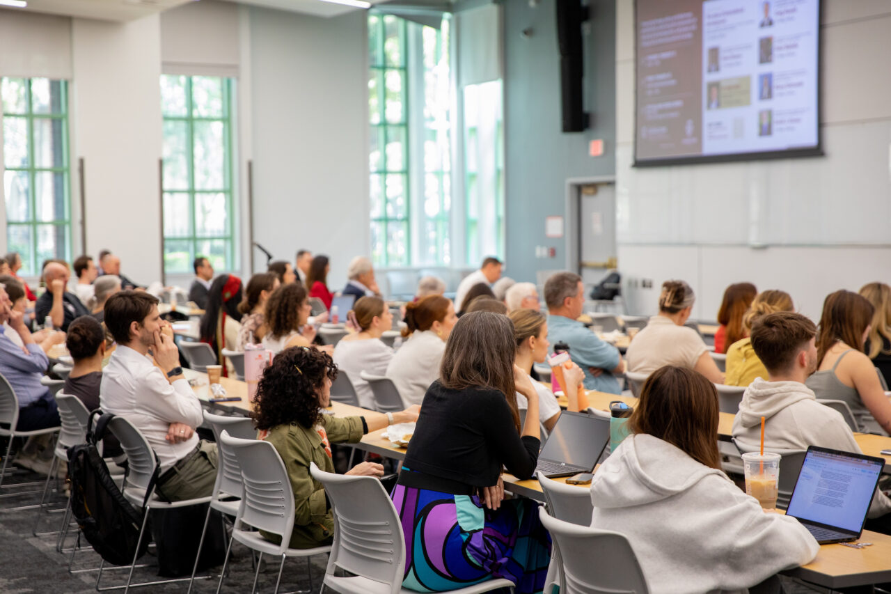 Students listen to speakers in classroom