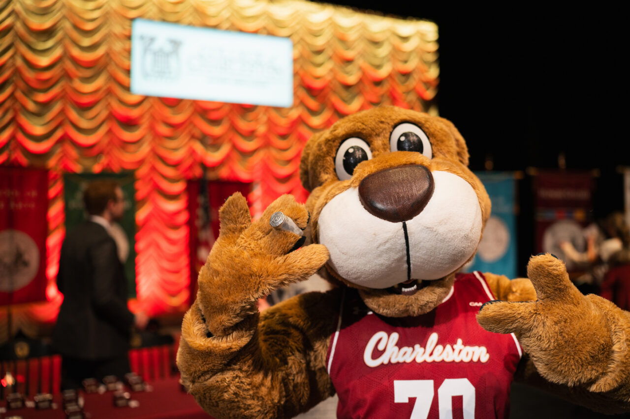 Clyde holds up his paws with ring on it