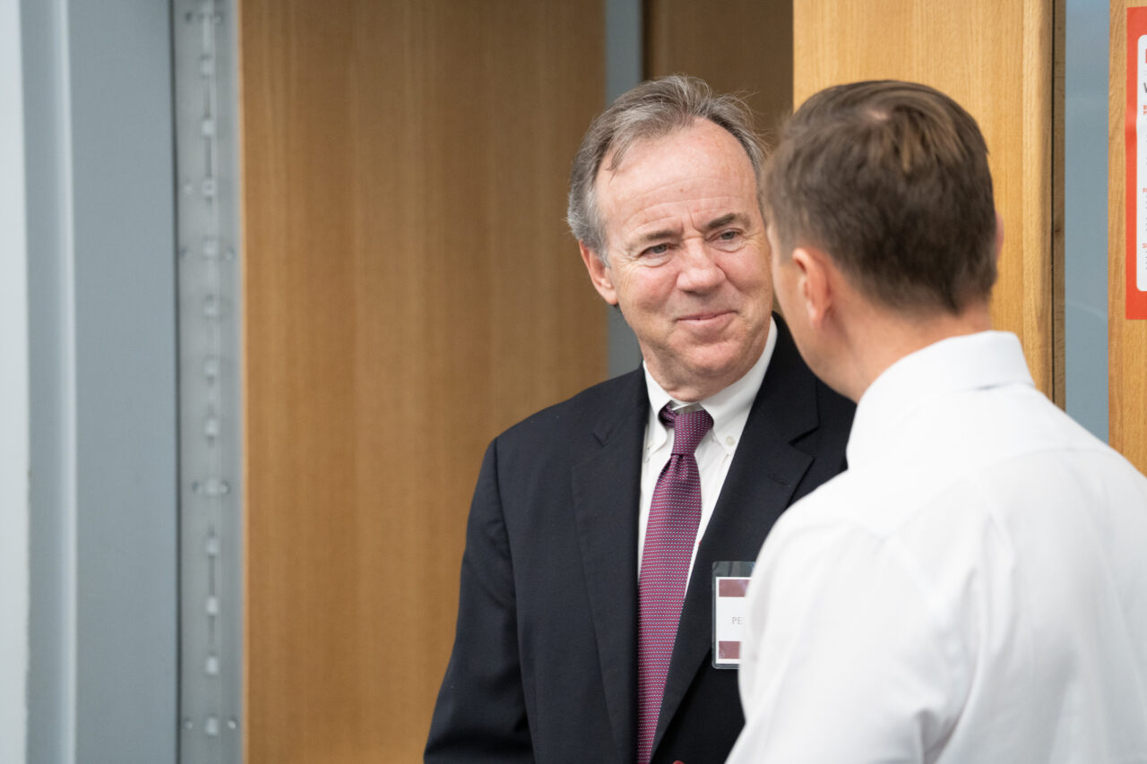 close up of speaker talking with another 