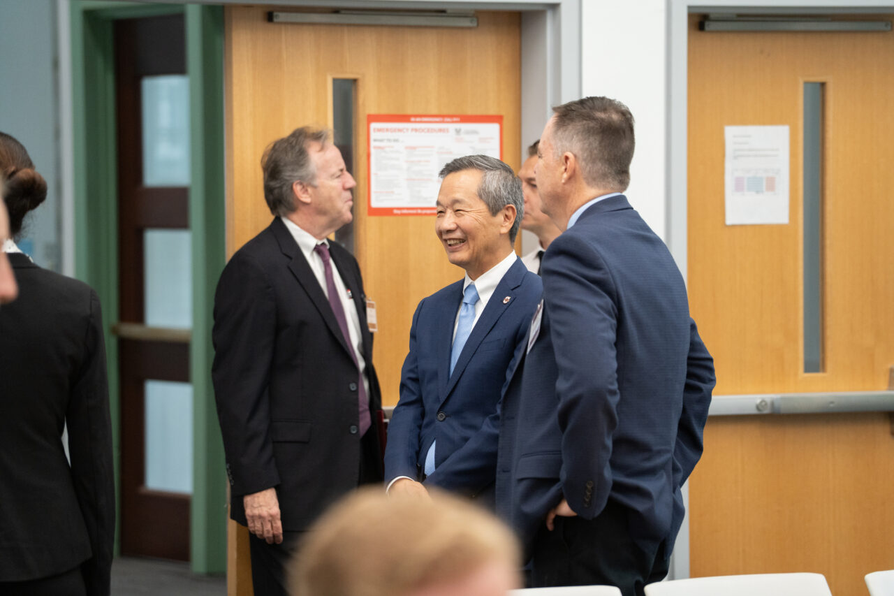 President Hsu speaks with panel members 