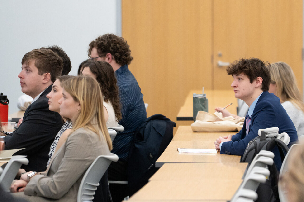 male student listens intently