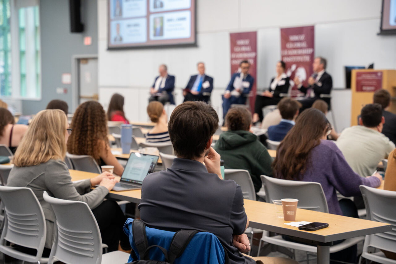 view from behind student listening to speakers