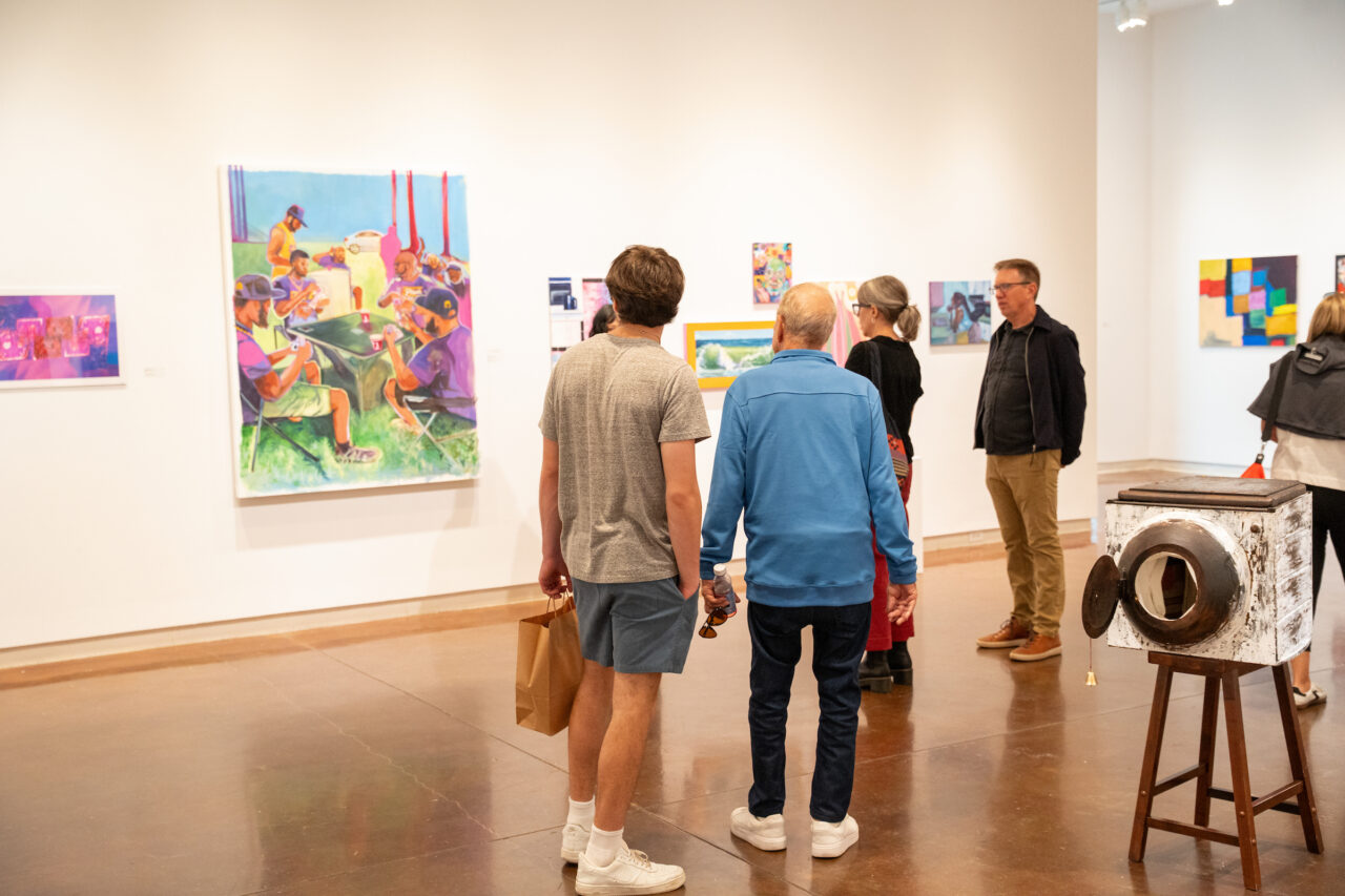 group of people tour the Halsey gallery