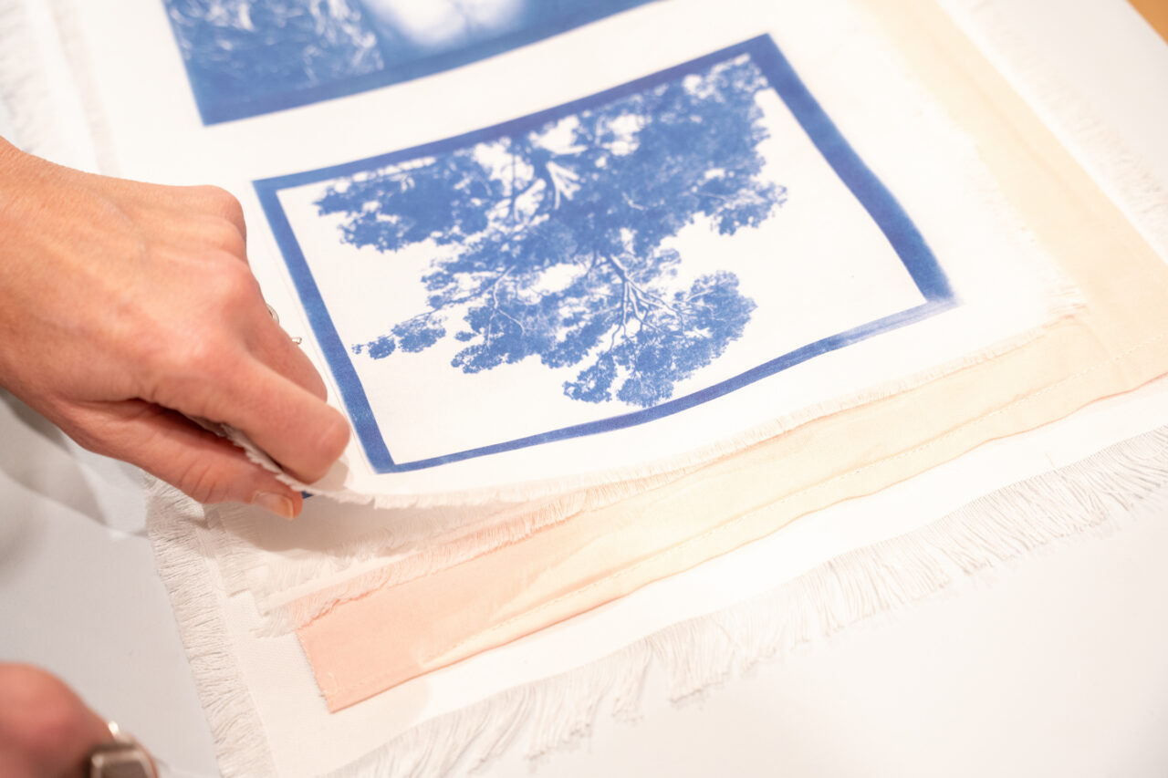 close up of art page with blue print of trees