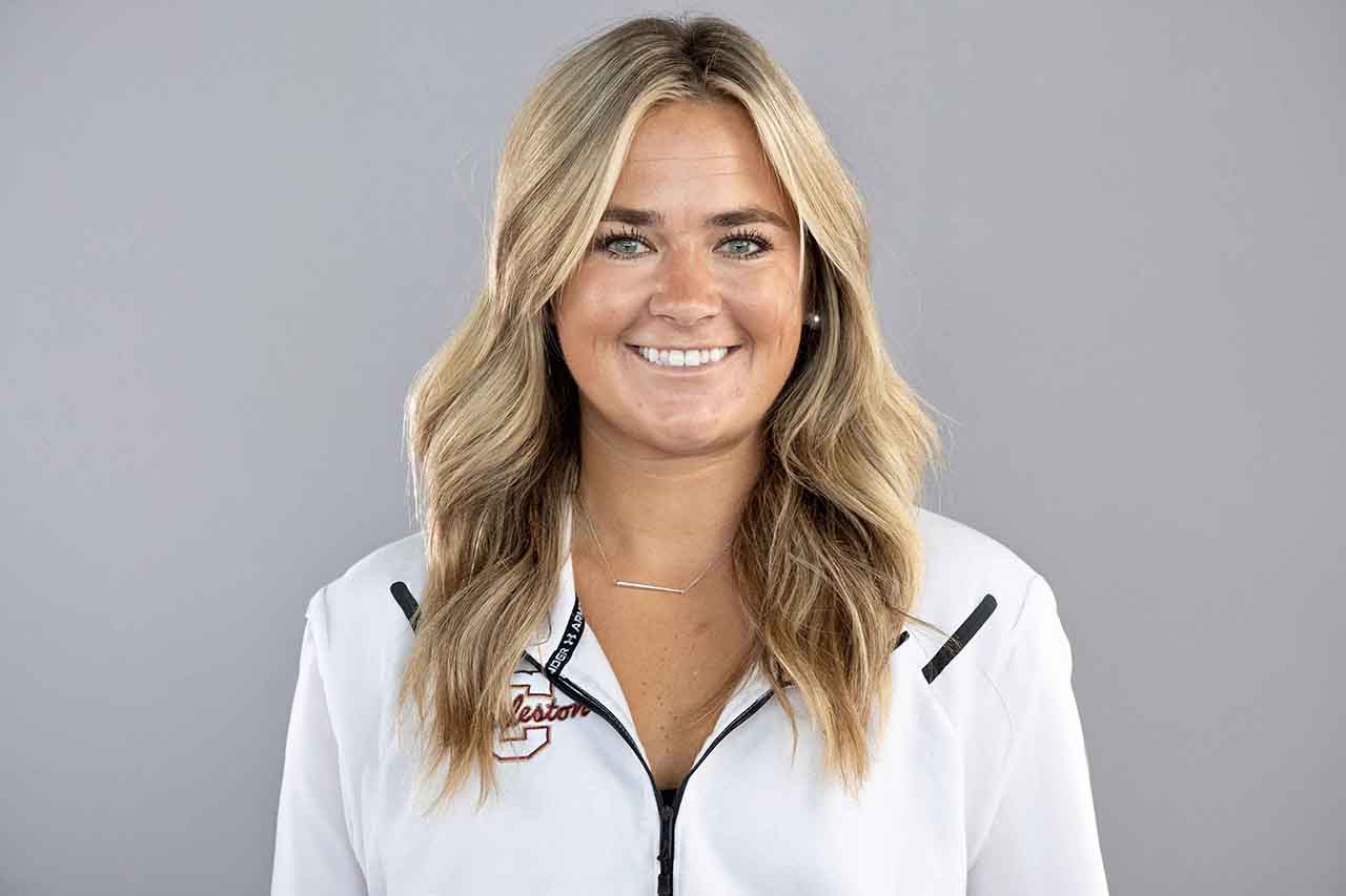 Sam Gjormand standing in front of graybackground