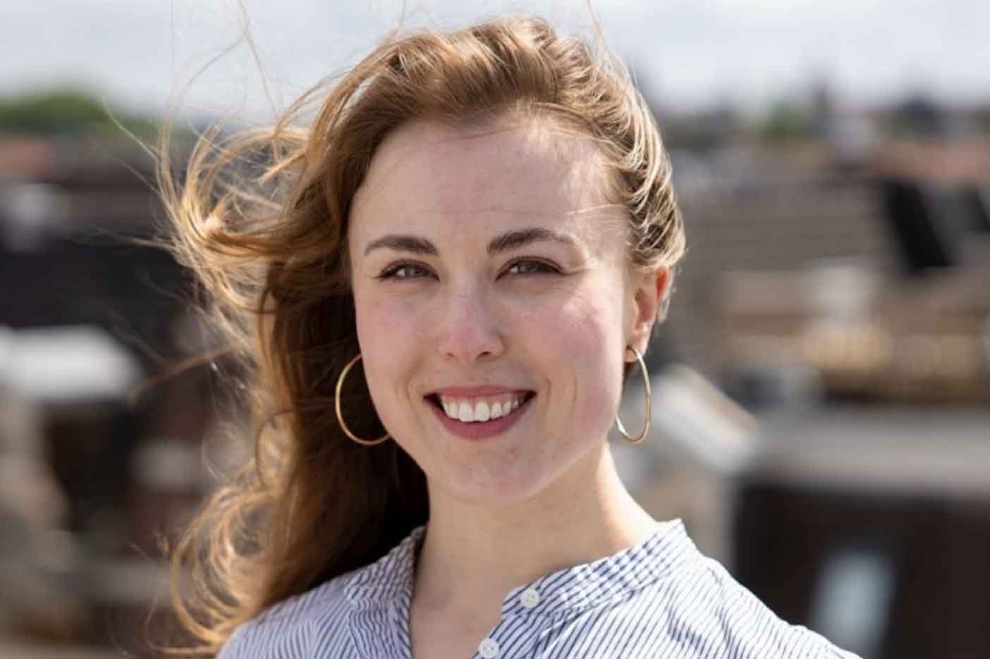 woman smiling with wind in hair