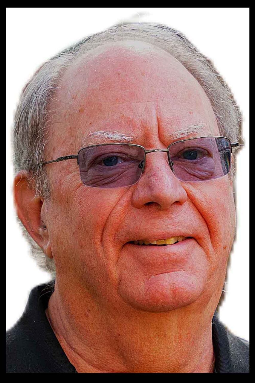 closeup of man's face on a white background with a black border