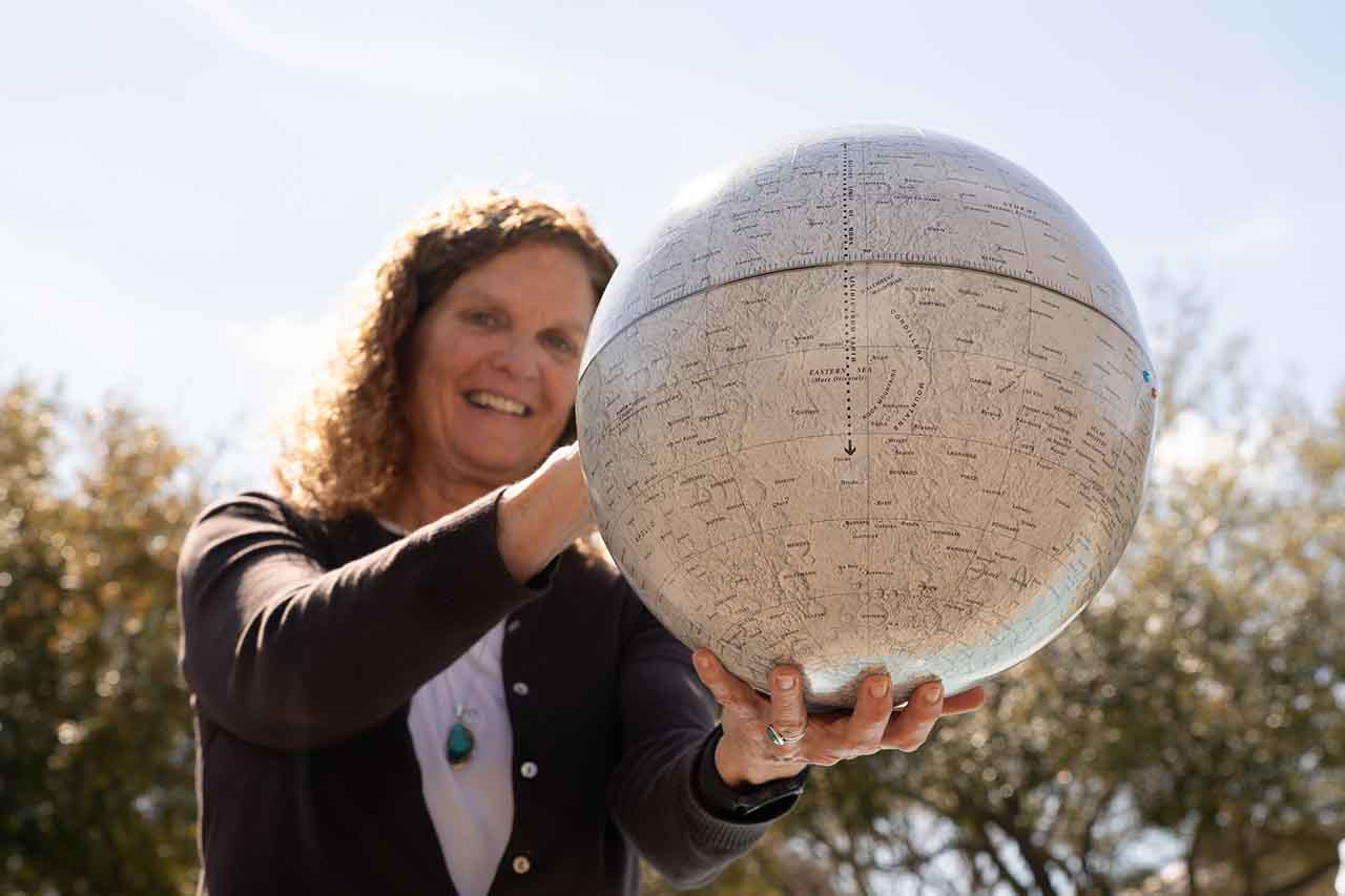 cass runyon with moon globe