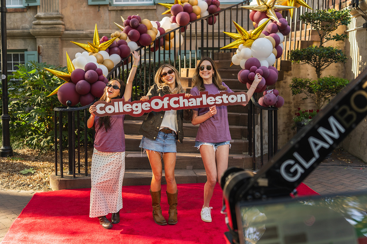 students with College of Charleston sign pose for Glambot