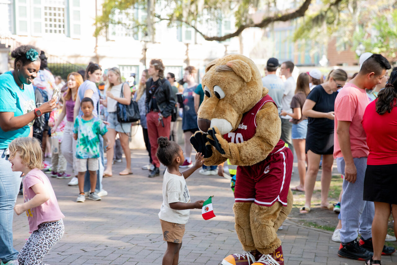 Little child gives Clyde a high five