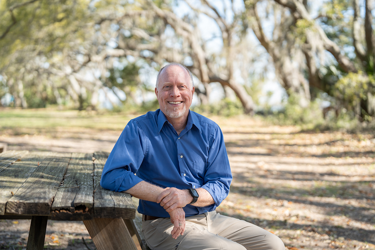 Greg Townsley sitting at a picnic table