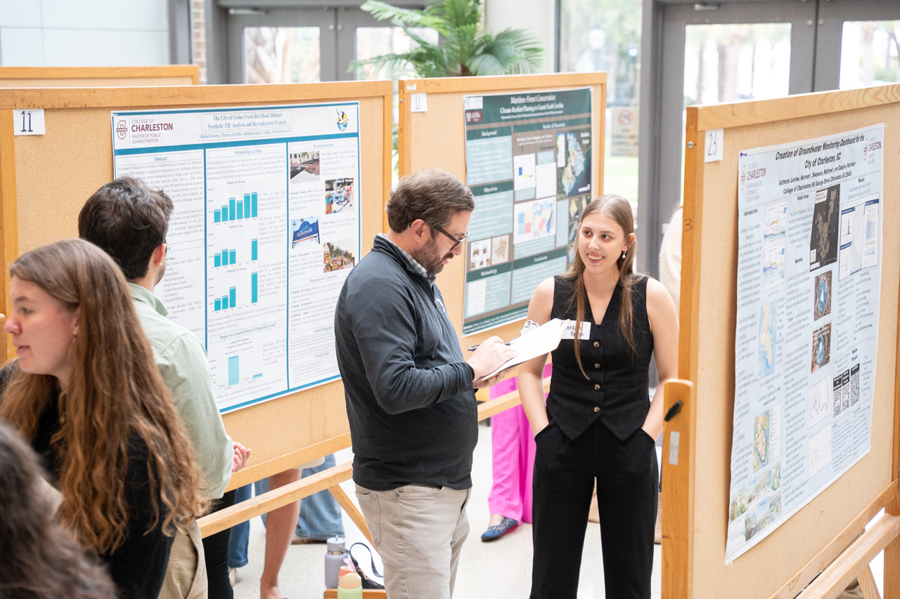 student discusses research with judge