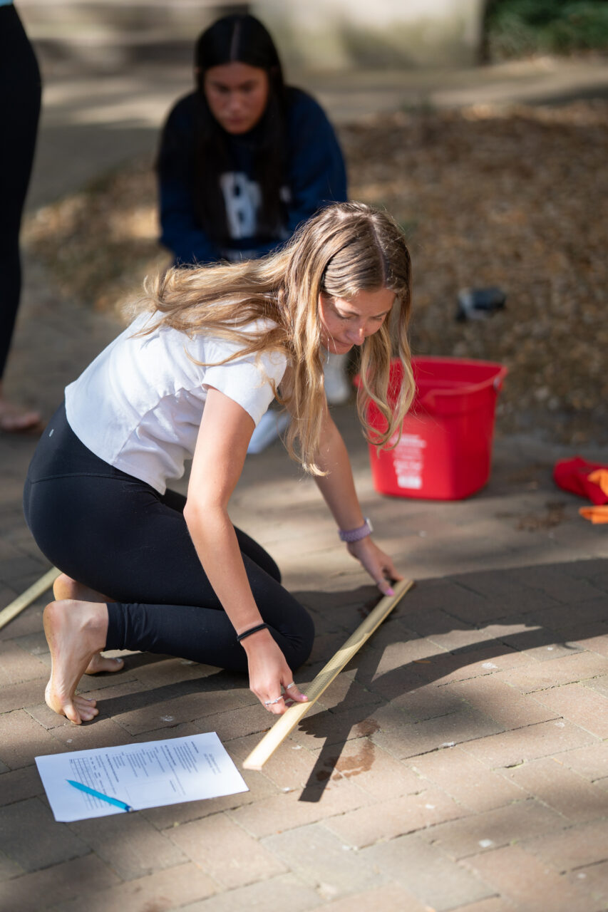 student takes measurements with a ruler