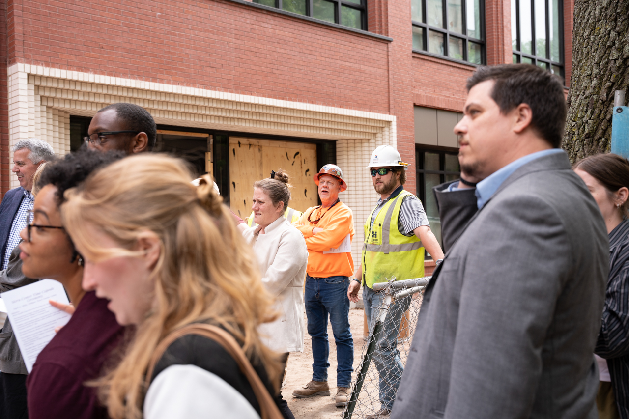 Construction Workers along with students and staff attend ceremony