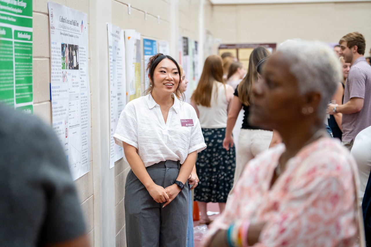 student smiles at EXPO