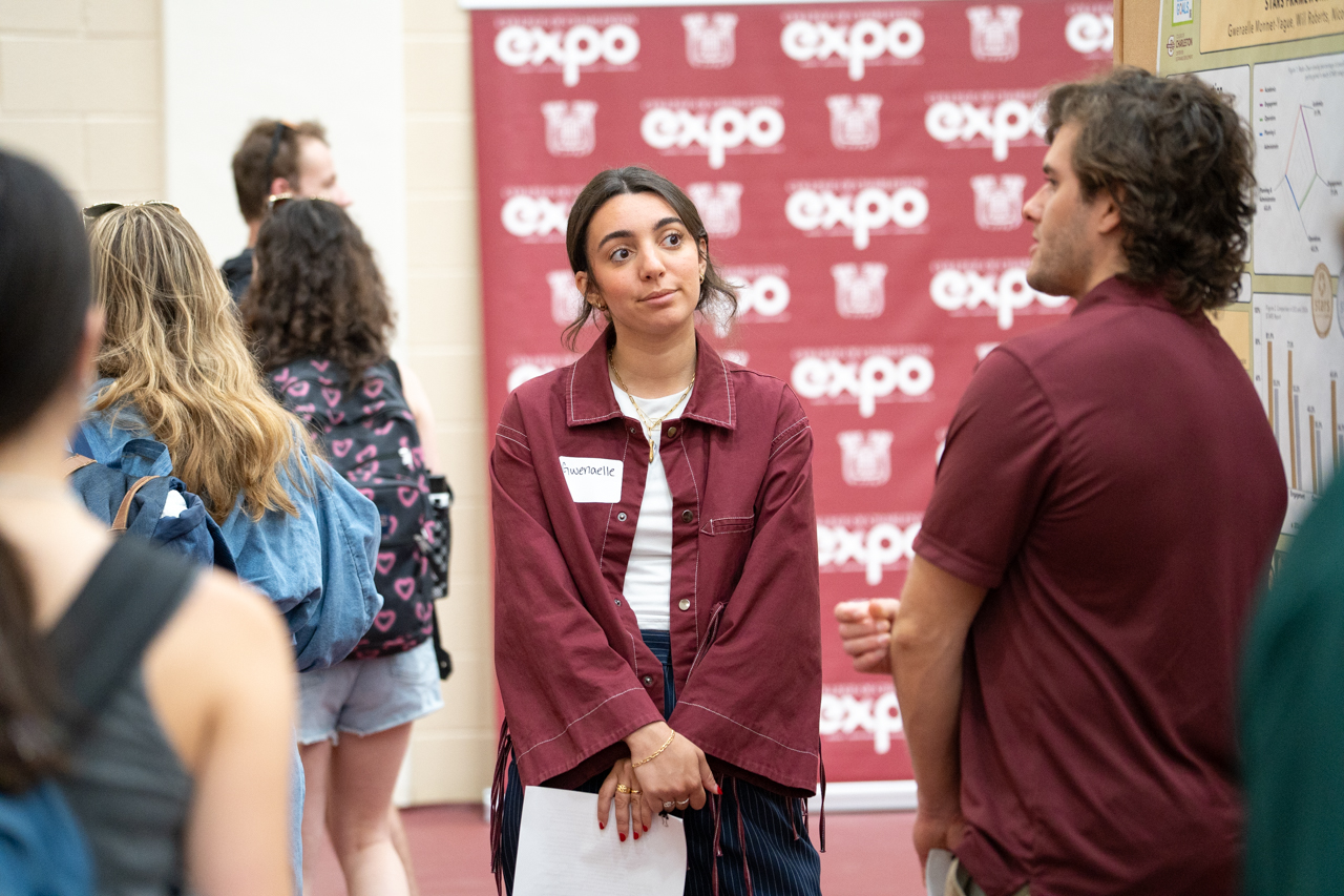 student looks at another student presenting information 