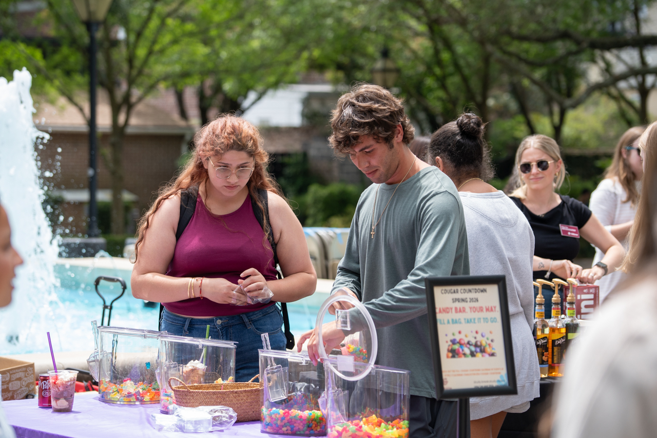 picking out sweet treats out of a jar