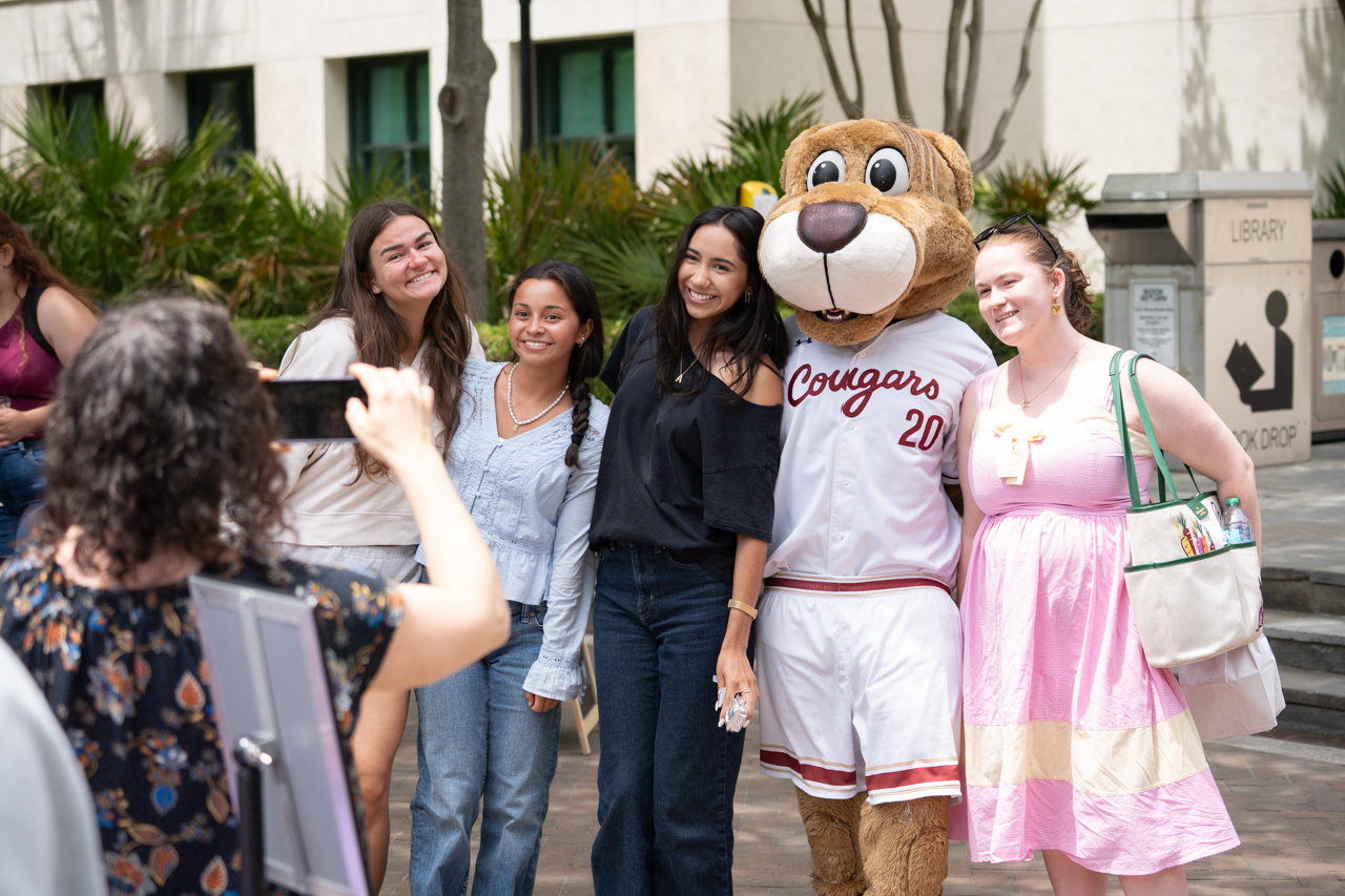 group takes photo with Clyde