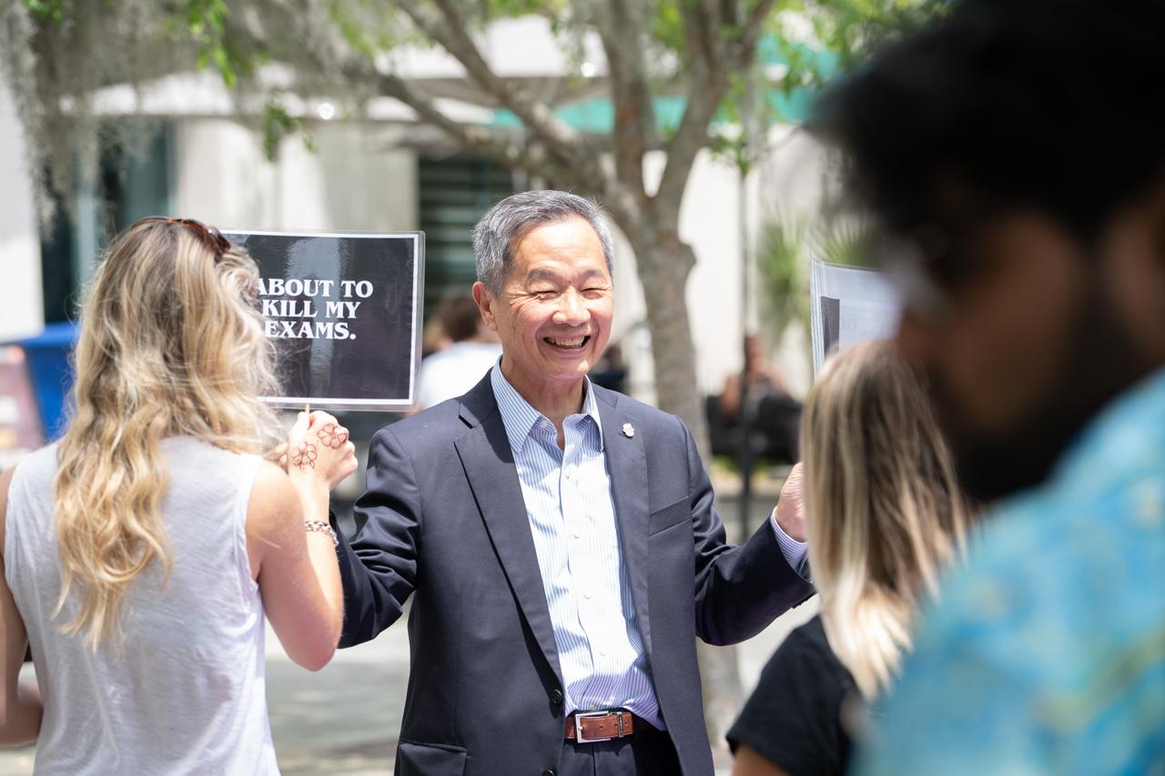 President Hsu Smiles holding up Selfie sign